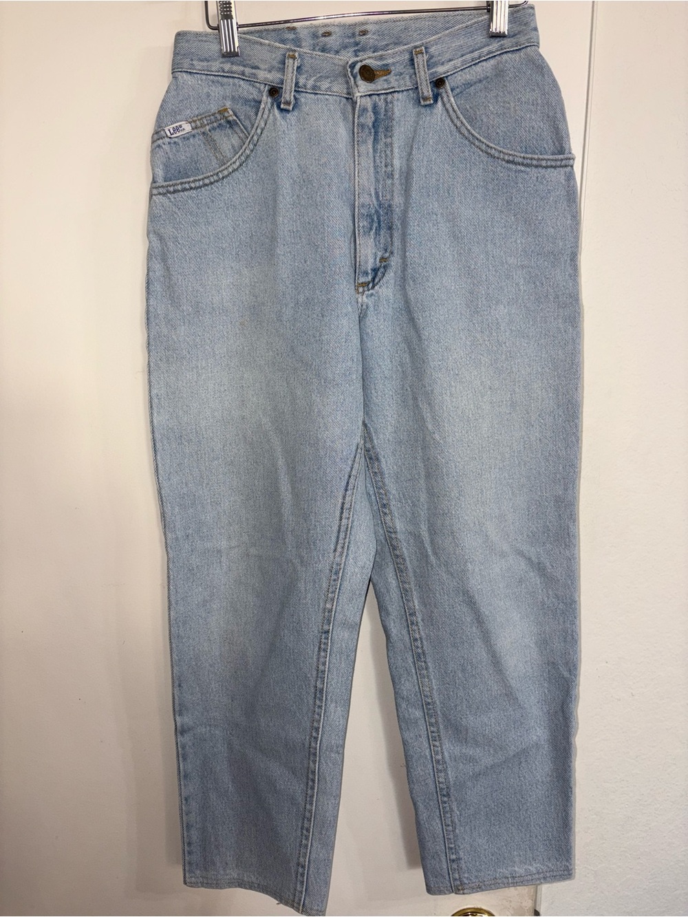 Lee vintage high-waist jeans feature a classic light-wash blue 11P